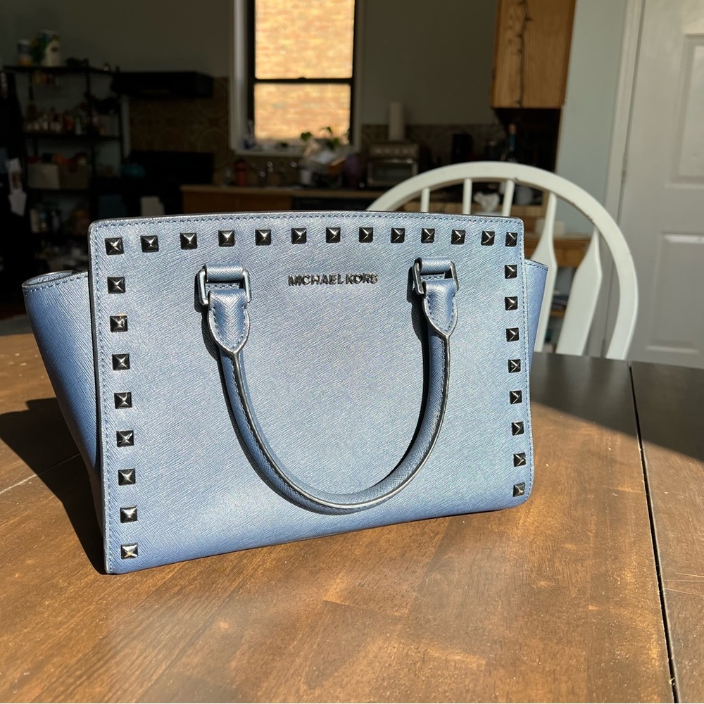 Great condition Michael Kors bag with optional strap. Navy blue and studded